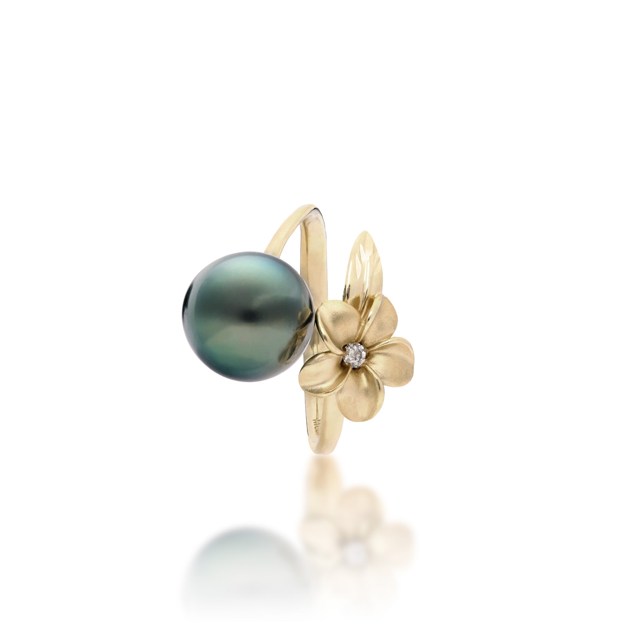 Top view of a 14k yellow gold bypass ring featuring a 10-11mm Tahitian black pearl and diamond-accented plumeria with a satin finish and diamond-cut leaf, set against a clean white background with a soft reflection.