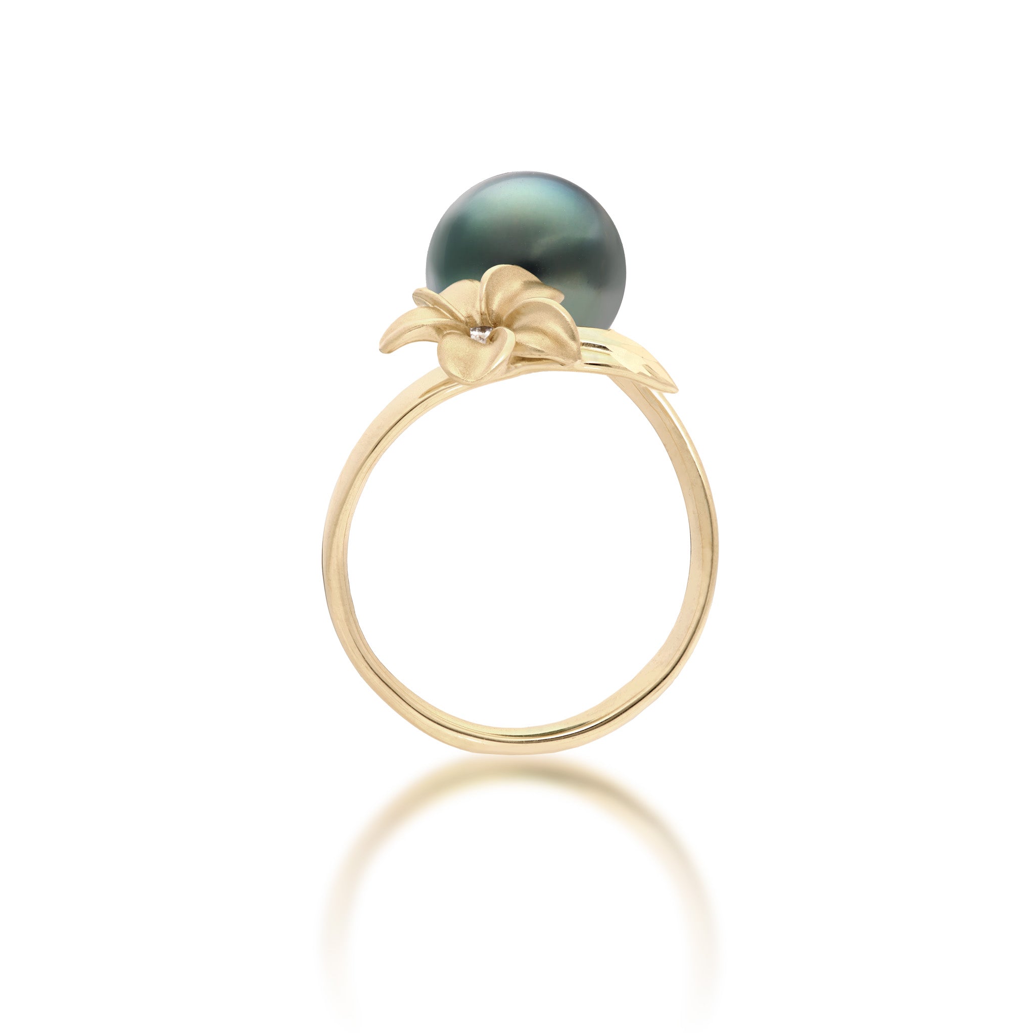Side view of a 14k yellow gold bypass ring featuring a 10-11mm Tahitian black pearl and diamond-accented plumeria with a satin finish and diamond-cut leaf, set against a clean white background with a soft reflection.