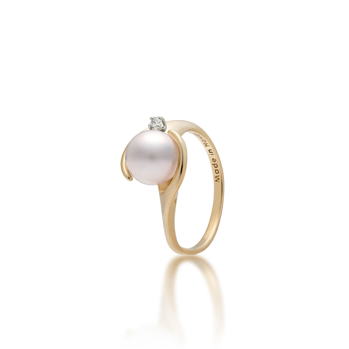 A 14k yellow gold ring with soft curves at the crown that frame a diamond-accented Akoya white pearl, shown on a white background