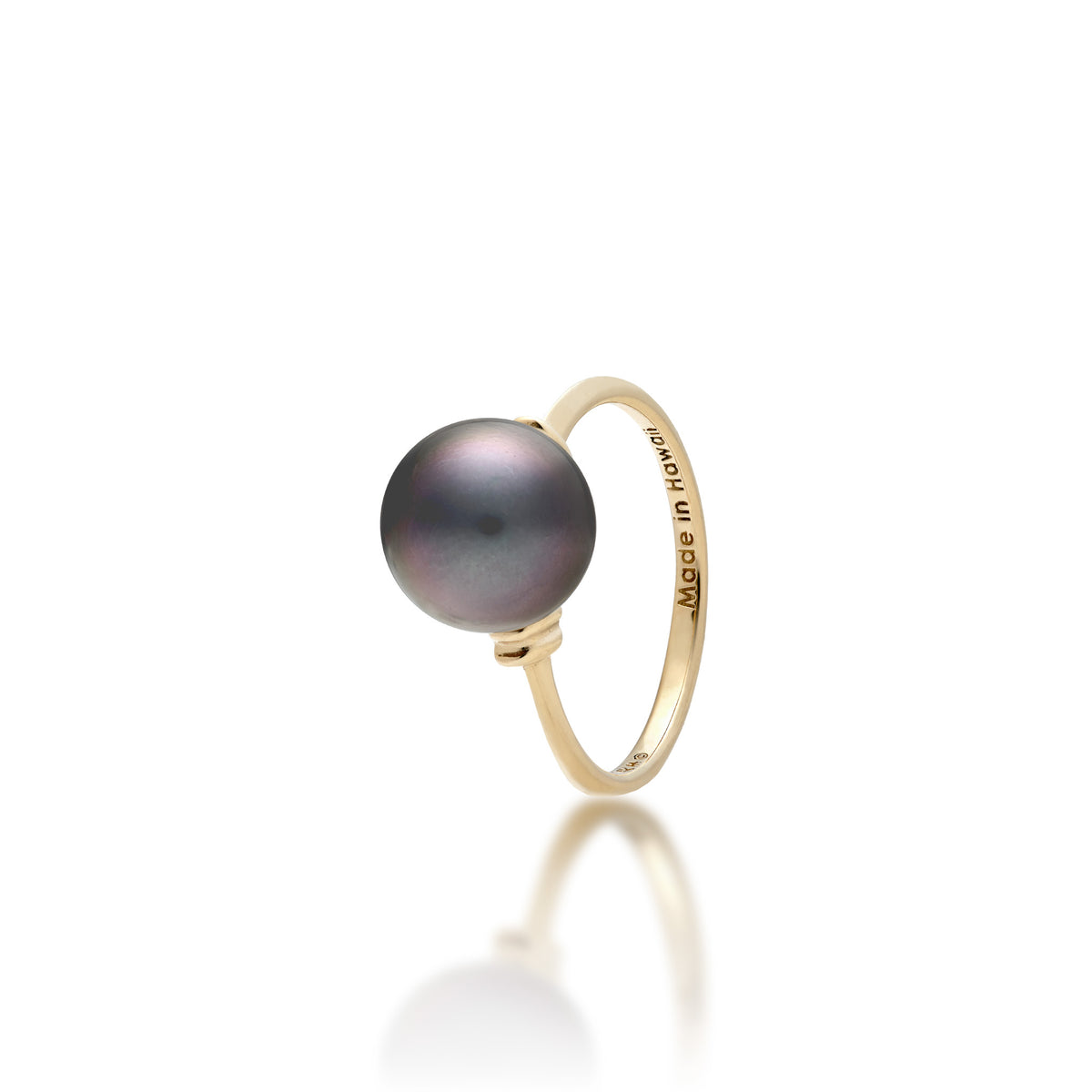 A 14k yellow gold ring with a Tahitian black pearl and raised divot gold accents on each side of the pearl, shown on a white background
