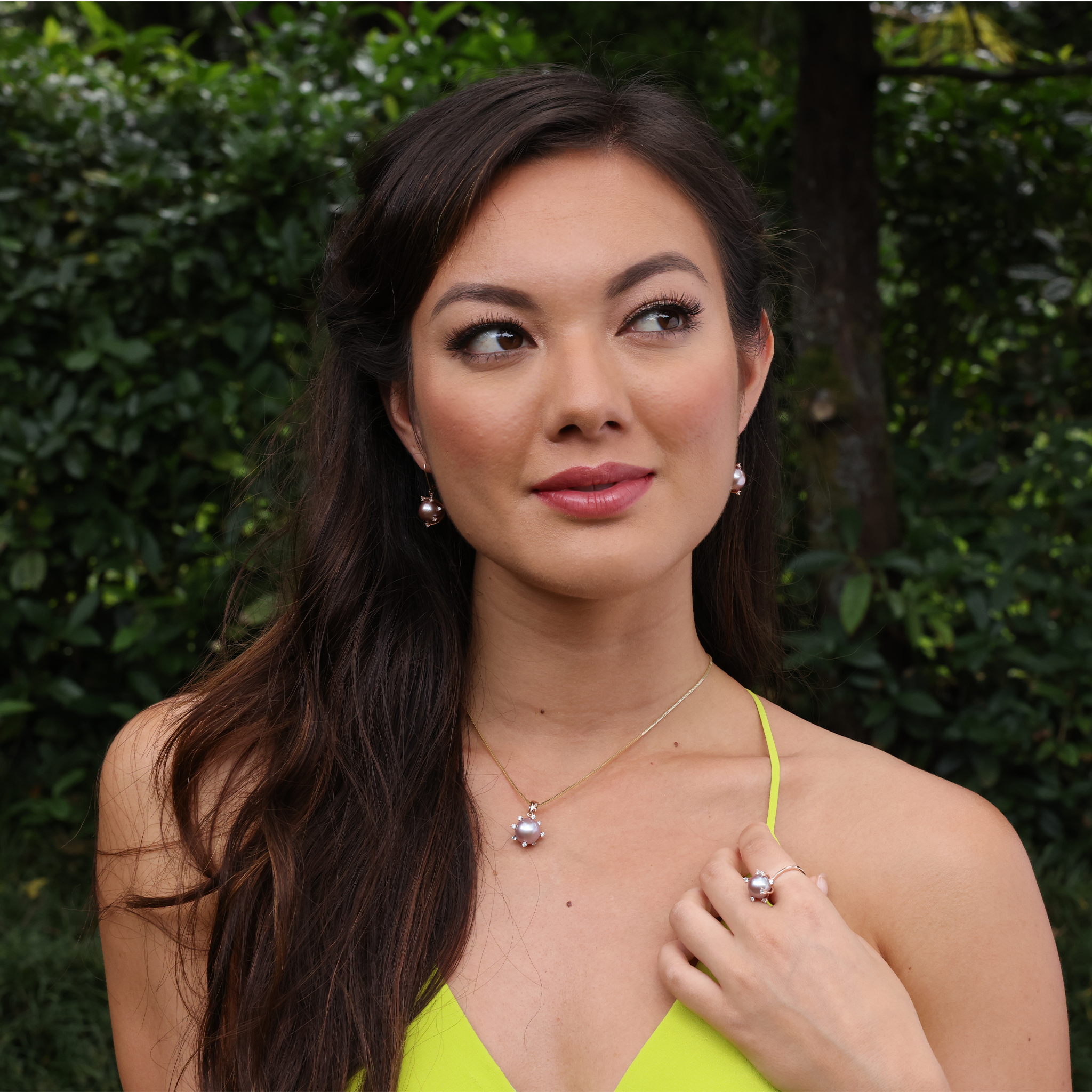 A woman wearing a Protea Lilac Freshwater Pearl Ring in Rose Gold with Diamonds-Maui Divers Jewelry