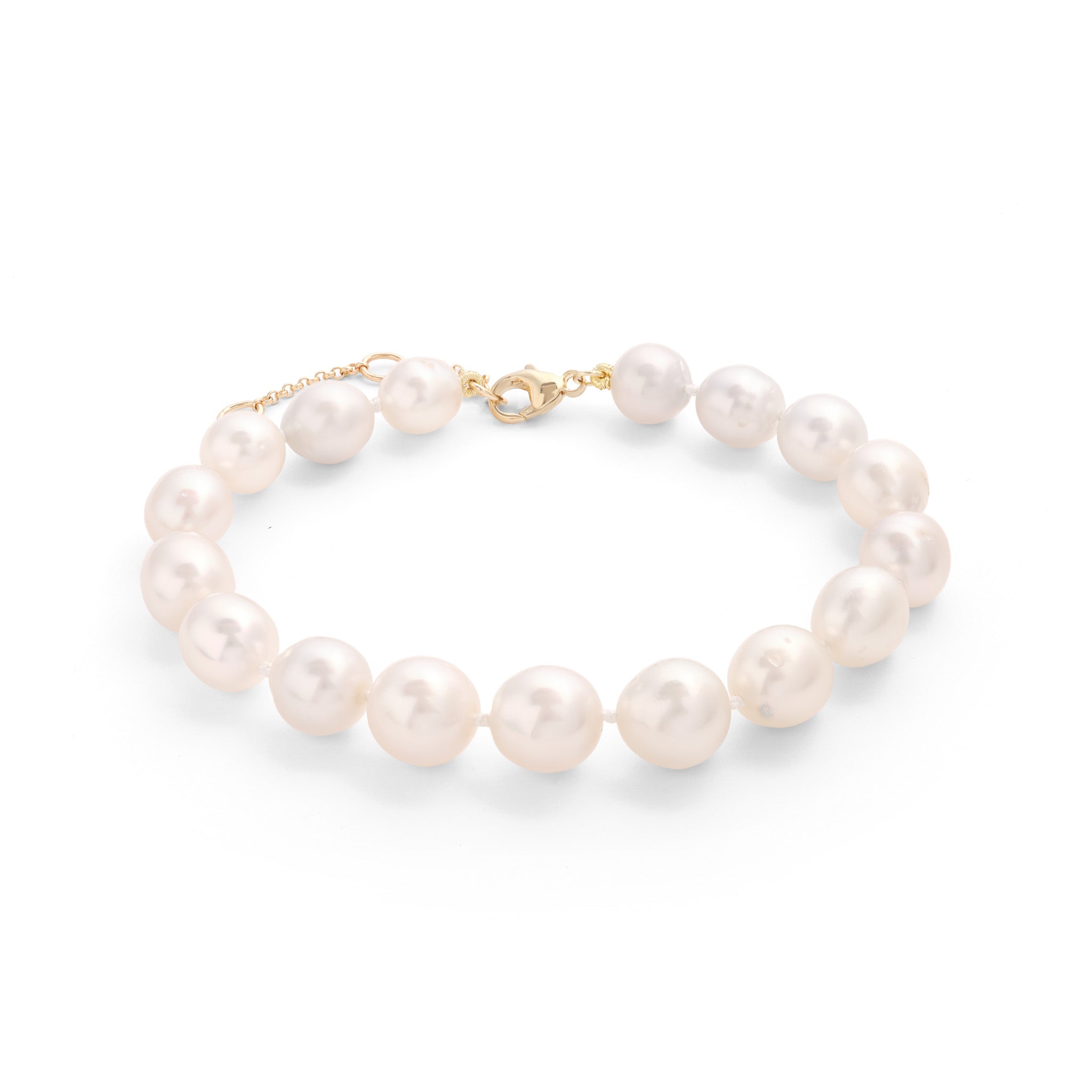 Side view of an 8-9.5" Adjustable 9-13mm South Sea Silver and White Pearl Bracelet in Gold on a white background