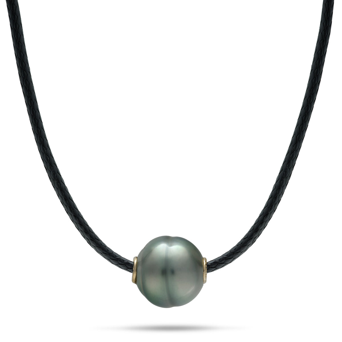 A black cord necklace with a 10-12mm circlé Tahitian black pearl with gold accents on each side, shown on a white background