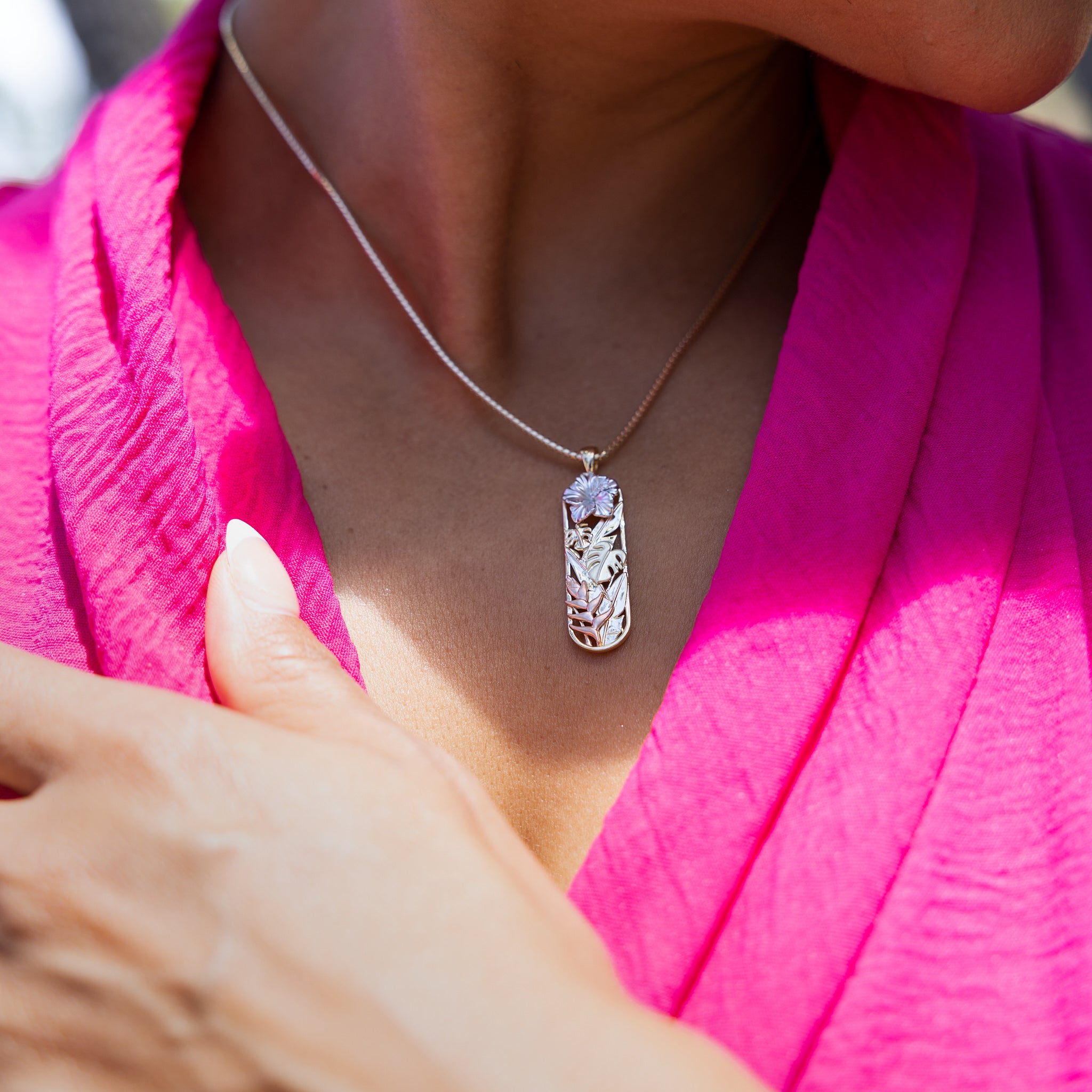 Close up of woman wearing Hawaiian Gardens Hibiscus Pendant in Multi Color Gold with Diamonds