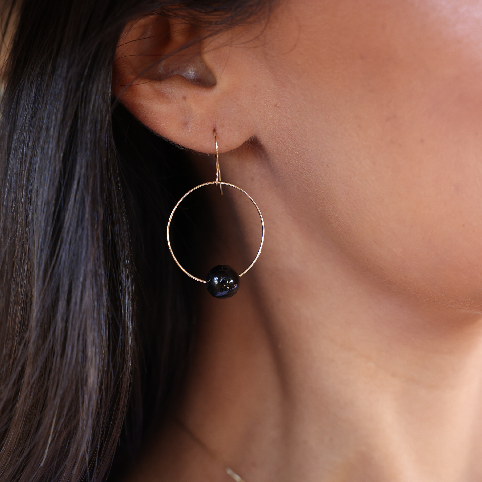 Maui Divers Jewelry Hawaiian Black Coral Earrings in Gold on Ear