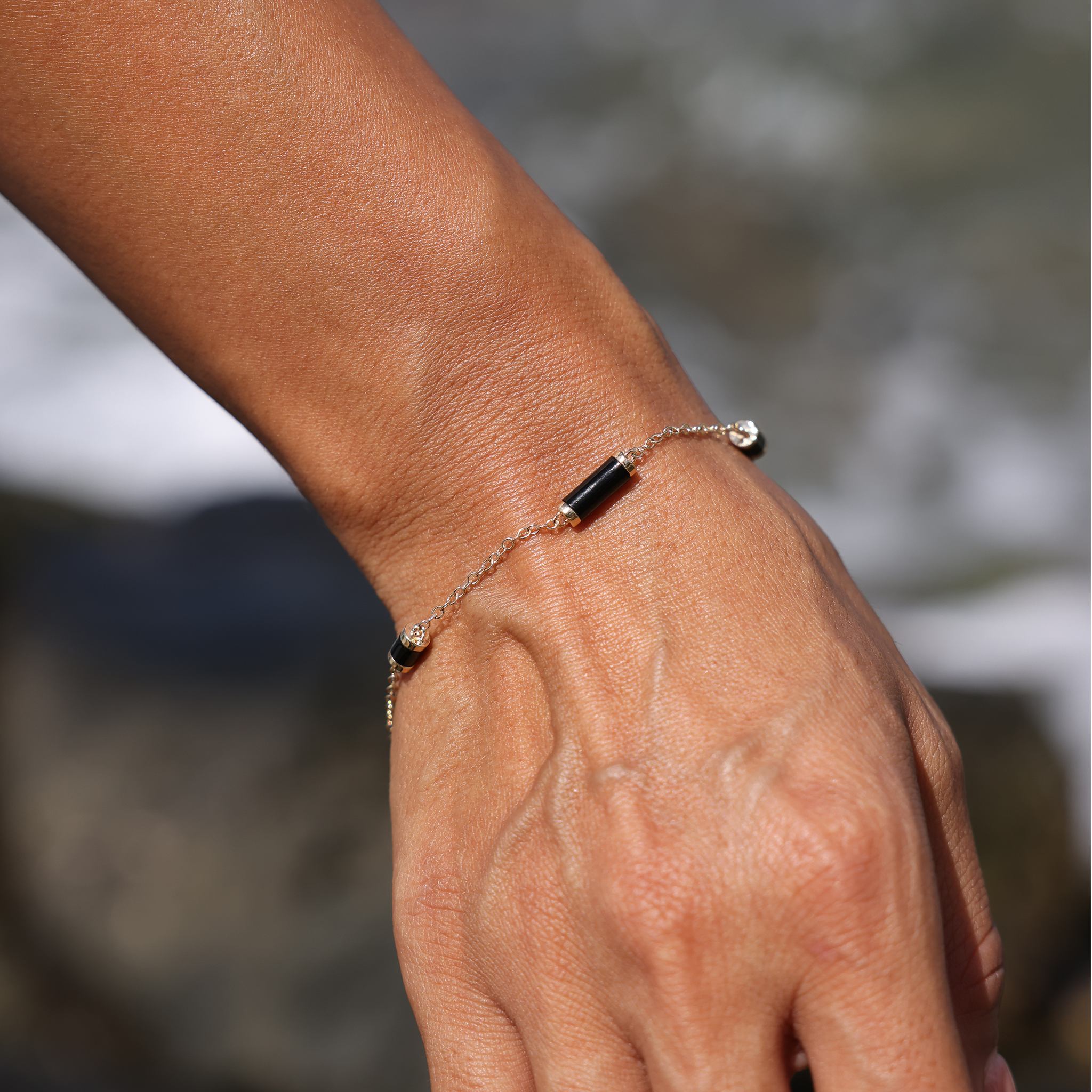 Adjustable 7-7.5" Ocean Chimes Black Coral Bracelet in Gold