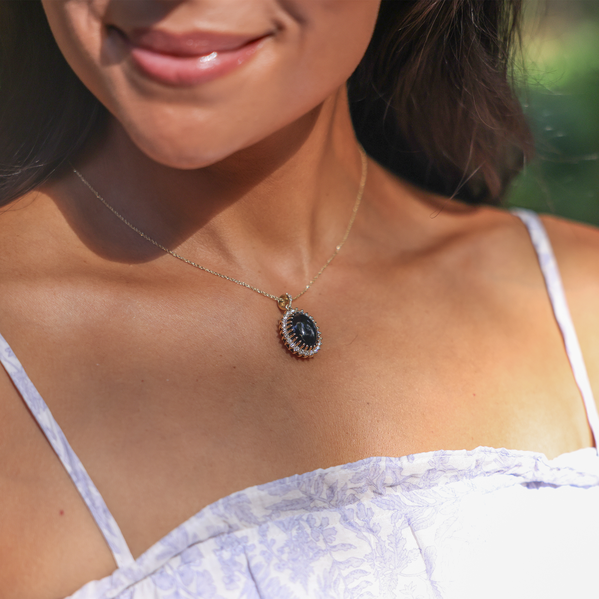 Close up of Princess Ka‘iulani Black Coral Pendant in Gold with Diamonds on neckline