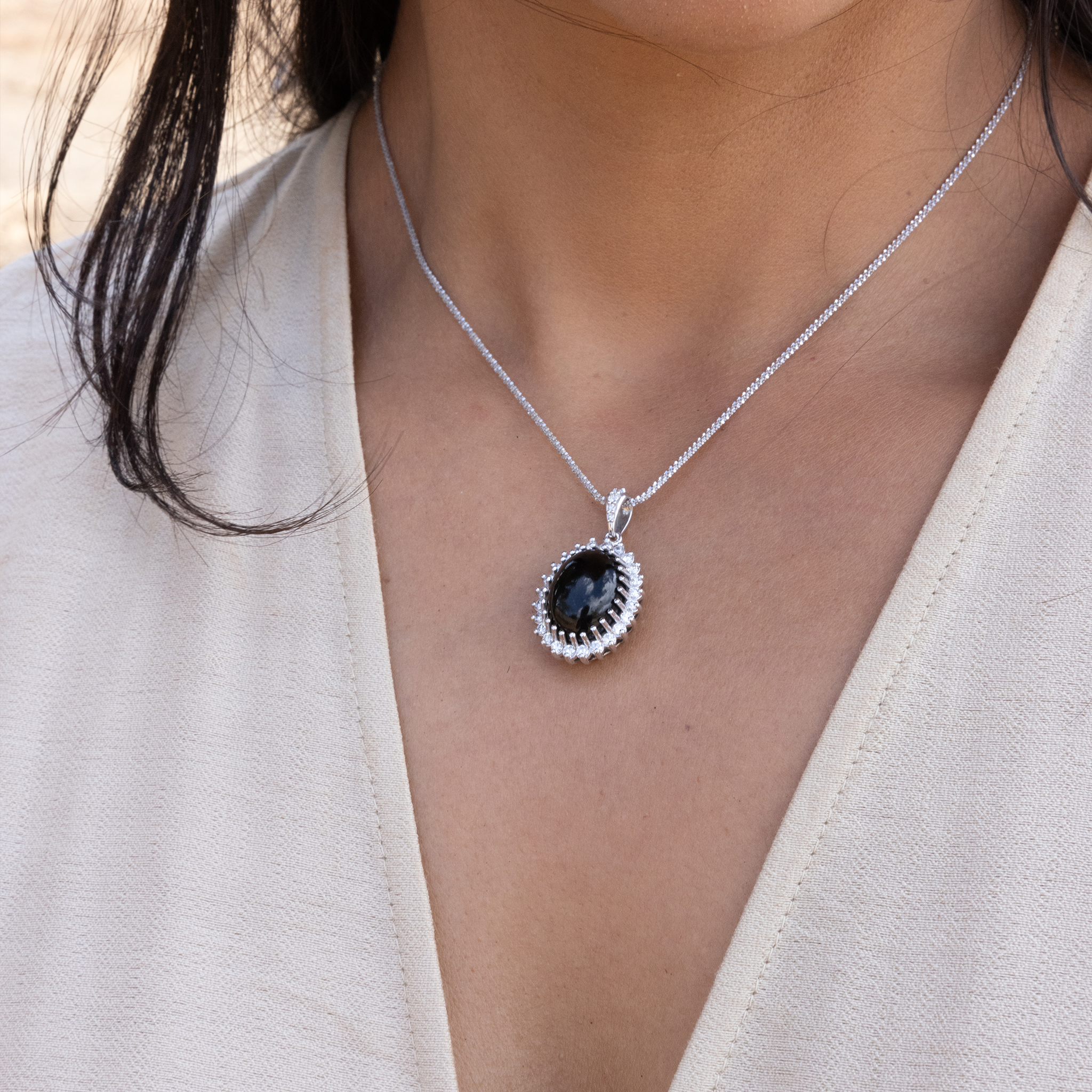 Close up of Princess Ka‘iulani Black Coral Pendant in White Gold with Diamonds on neckline