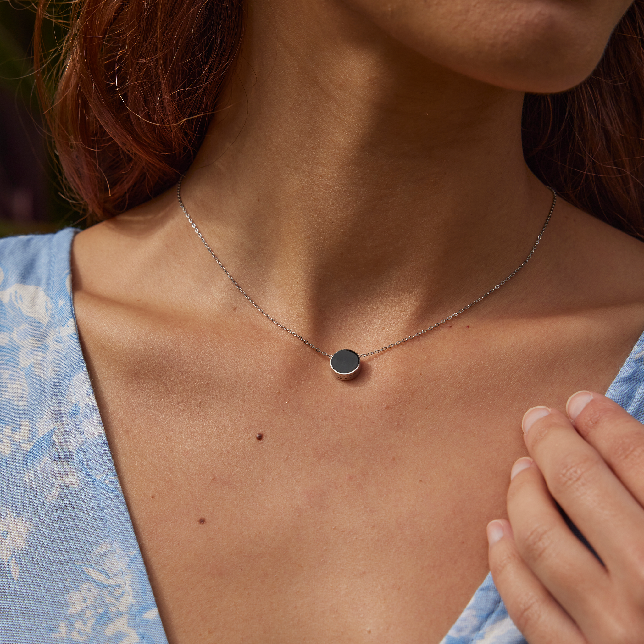 Woman wearing Eclipse Flipside Black Coral Necklace in White Gold