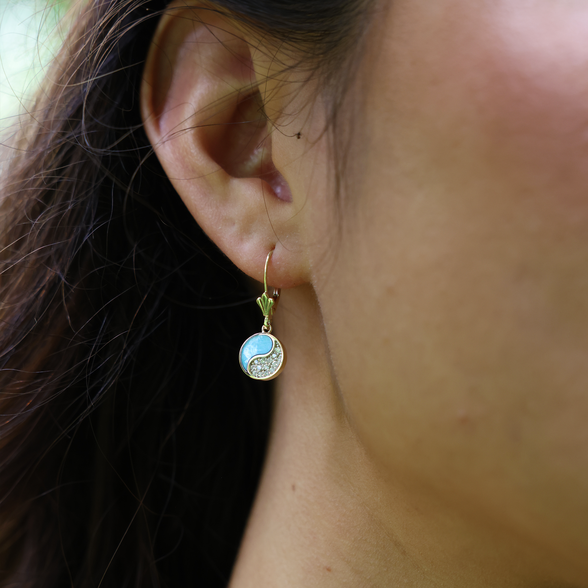 Yin Yang Turquoise Earrings in Gold with Diamonds close up on ear