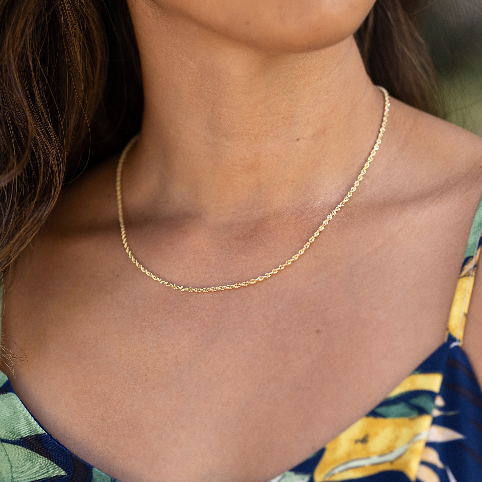 Close up of 2.5mm Rope Chain in 14k Yellow Gold on woman's chest