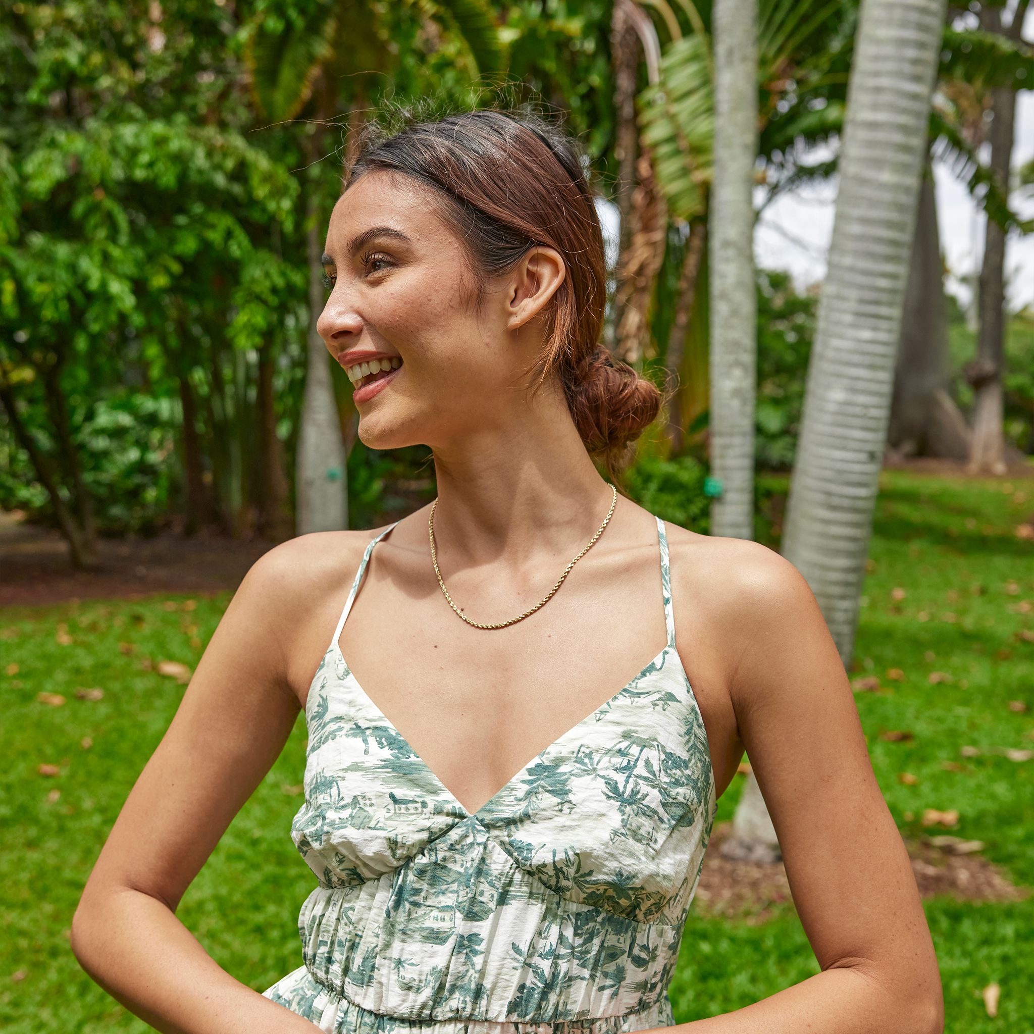 Woman in a garden wearing 2.5mm Rope Chain in 14k Yellow Gold