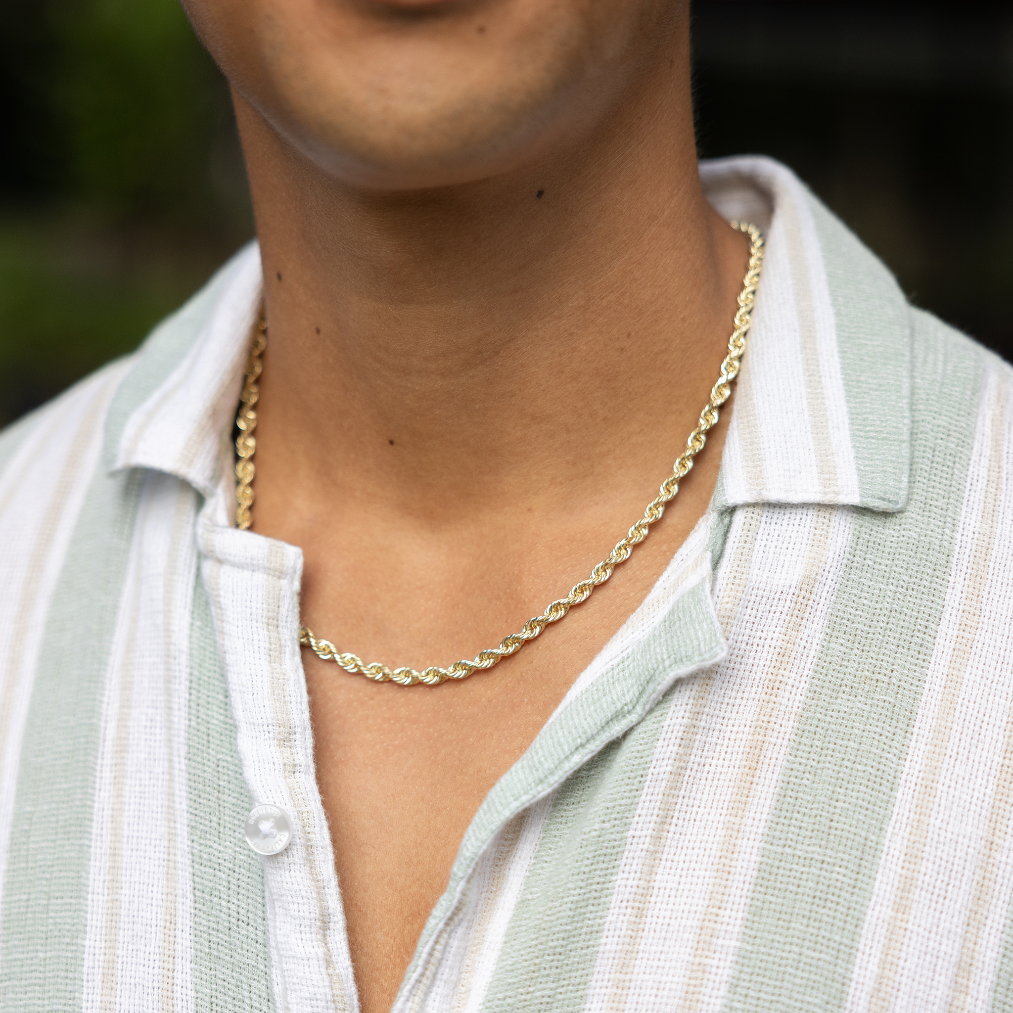 Close up of 5mm Rope Chain in 14k Yellow Gold on a man's neckline