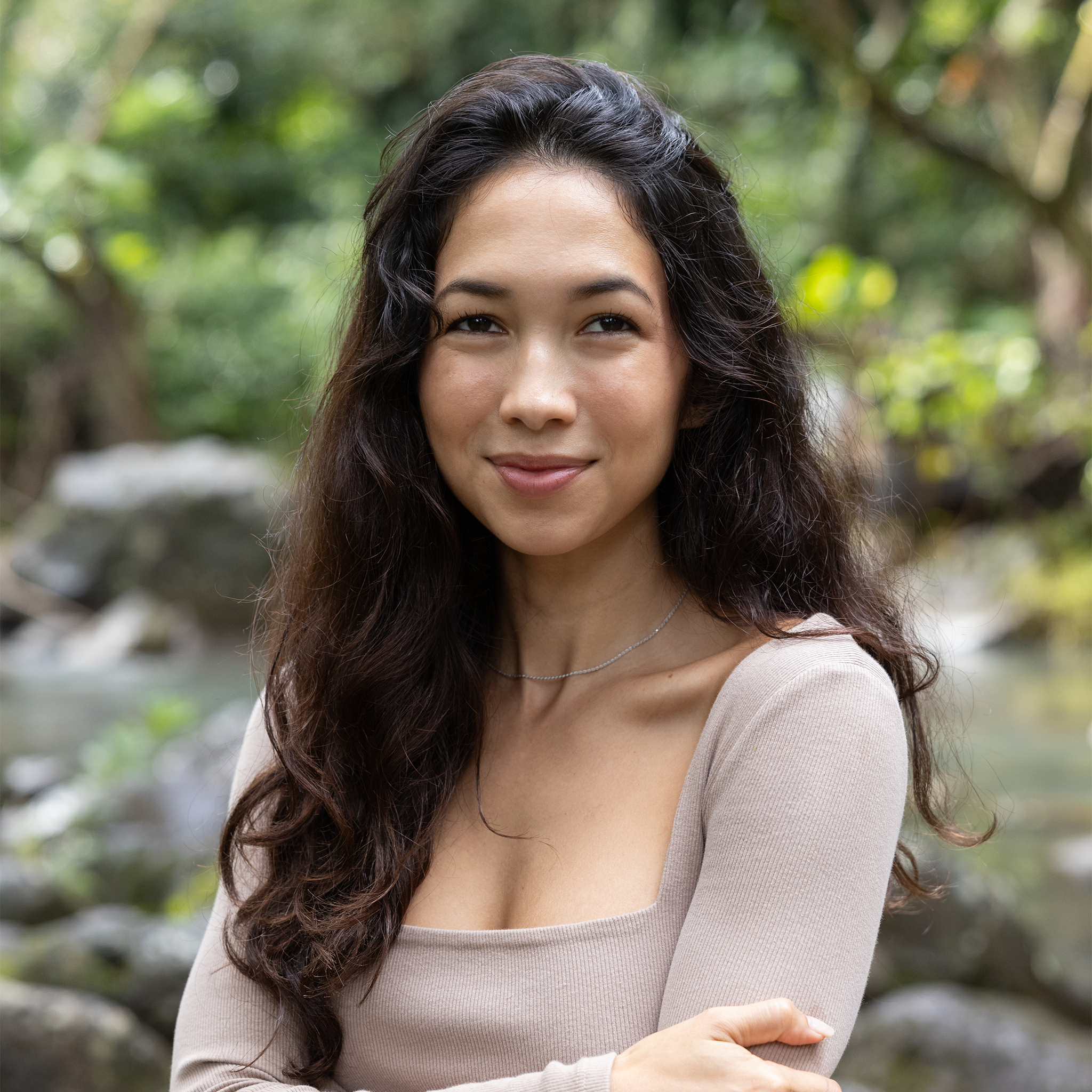 Woman in a garden wearing 1.2mm Flex Rope Chain in White Gold