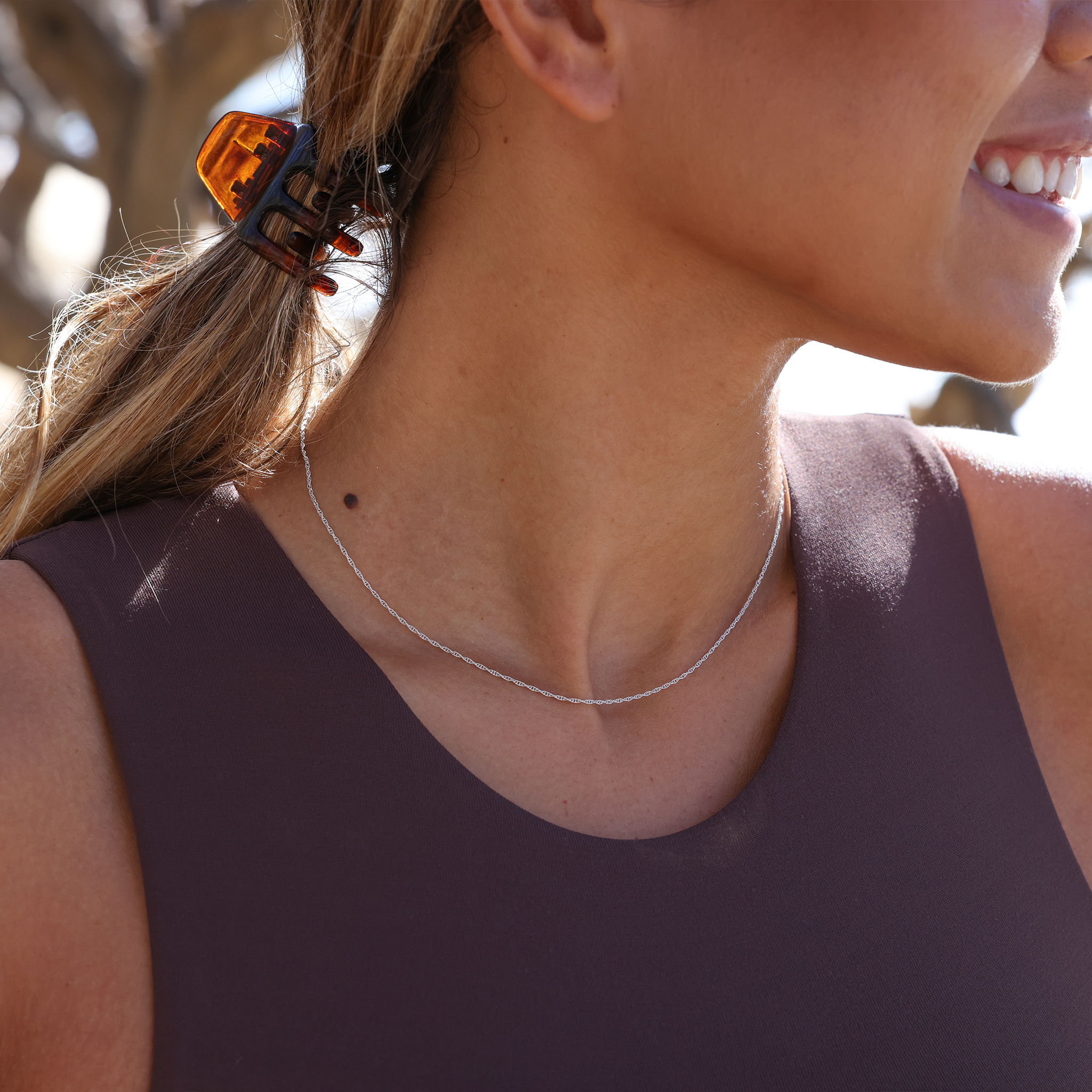 Close up of 1.5mm Double Rope Chain in Sterling Silver on a woman outdoors