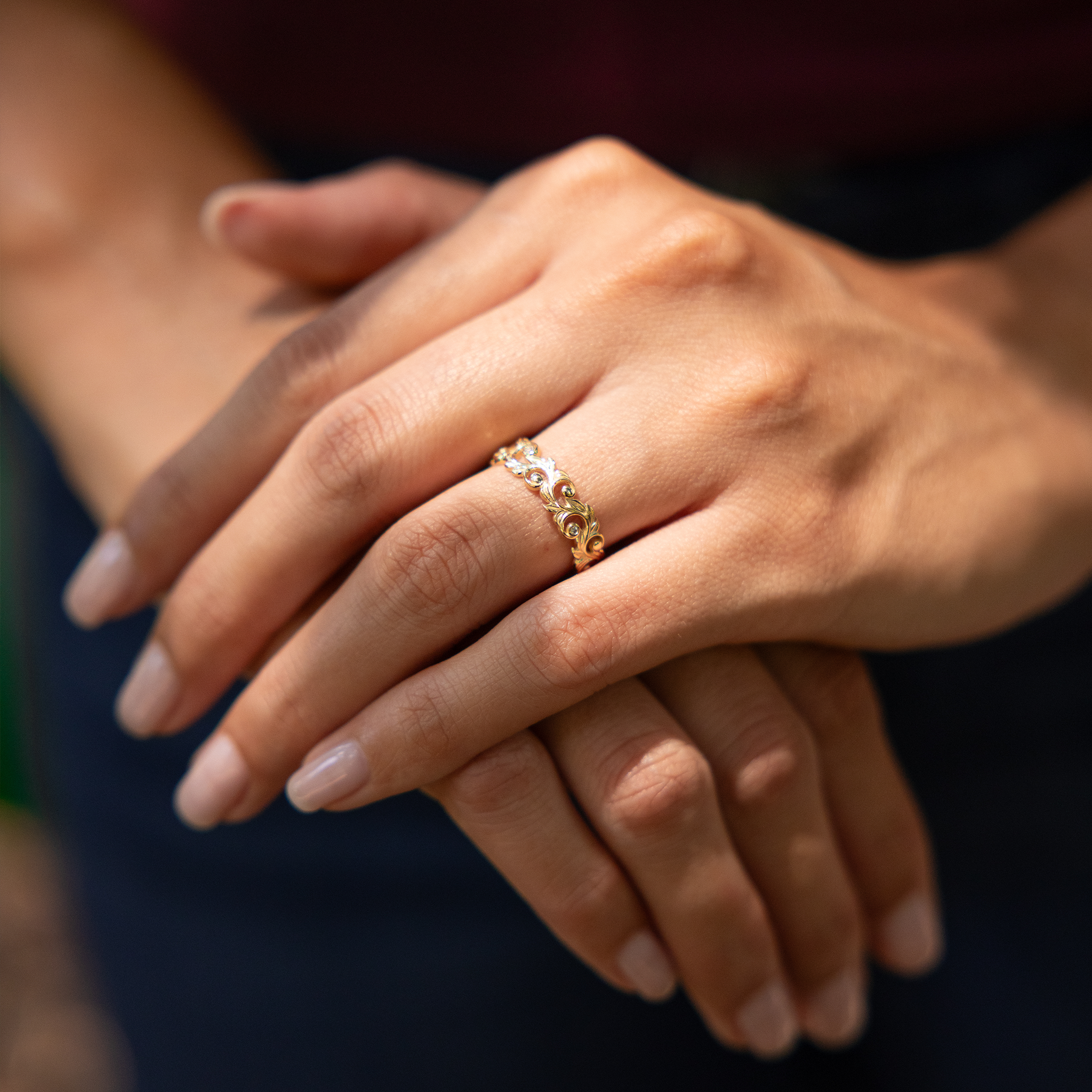 Woman's hands wearing a Living Heirloom Ring in Gold with Diamonds