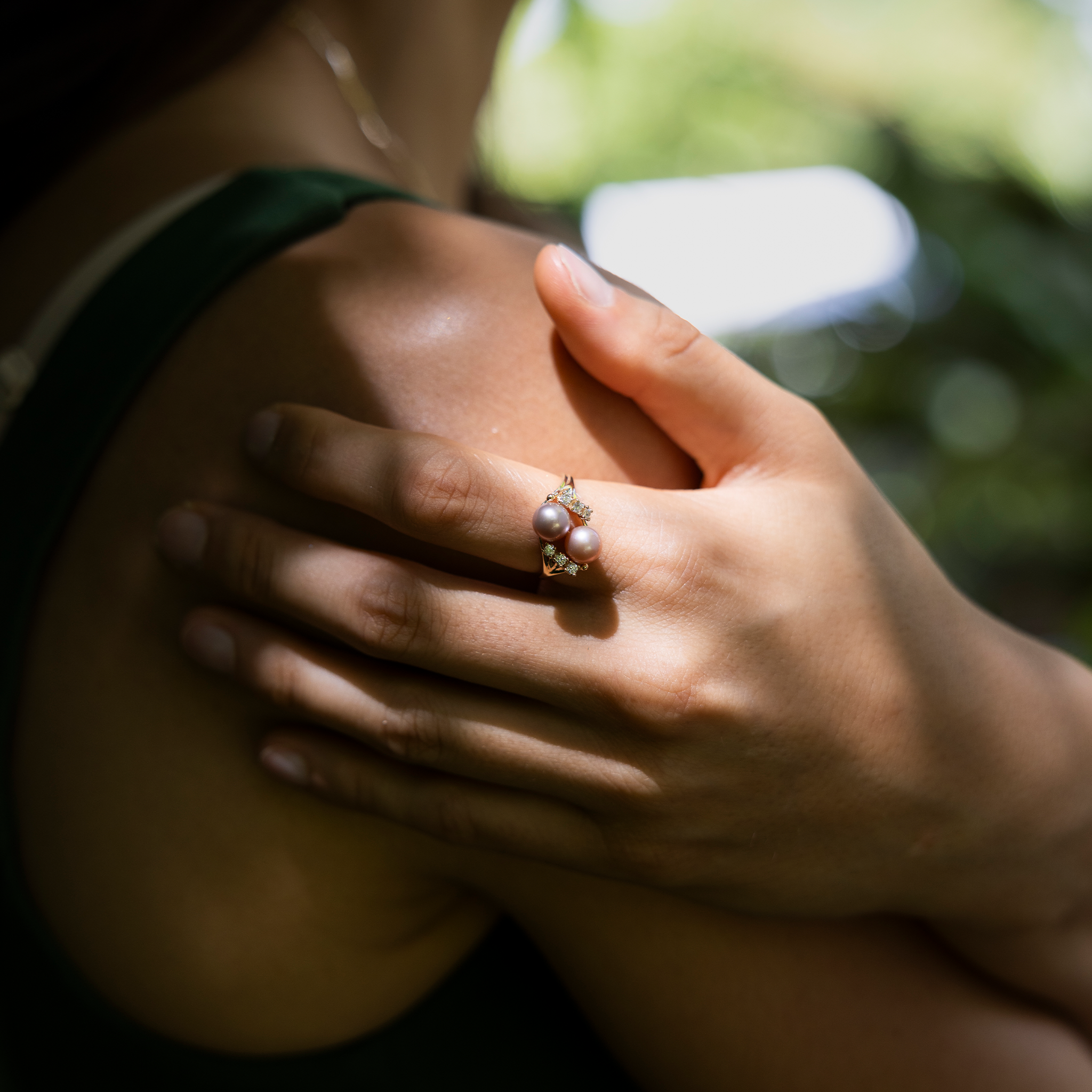 Pick A Pearl 8 Island Ring in Gold with Diamonds and Double Lavender Pearls on a hand holding their shoulder
