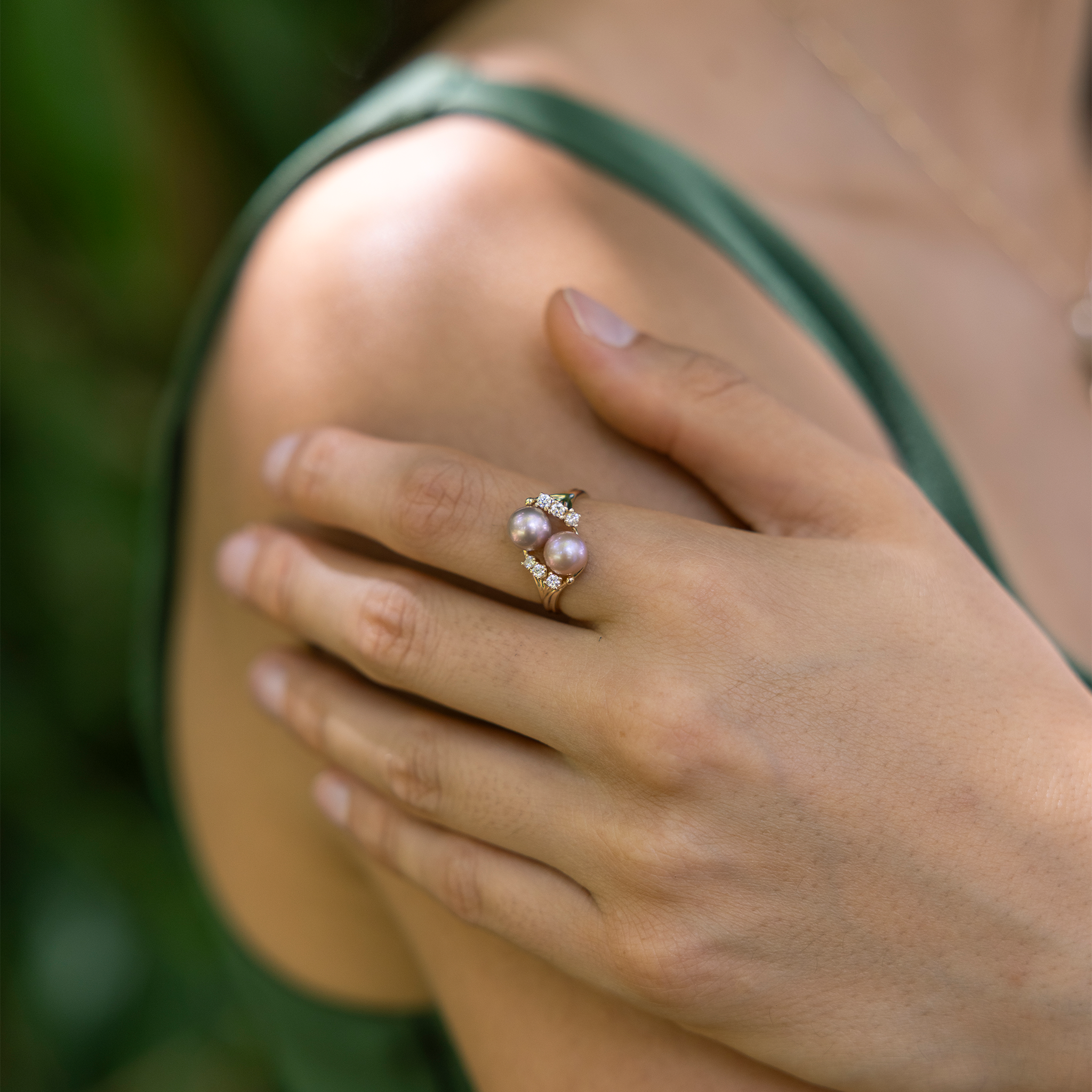 Pick A Pearl 8 Island Ring in Gold with Diamonds and Double Lavender Pearls on a hand holding their shoulder