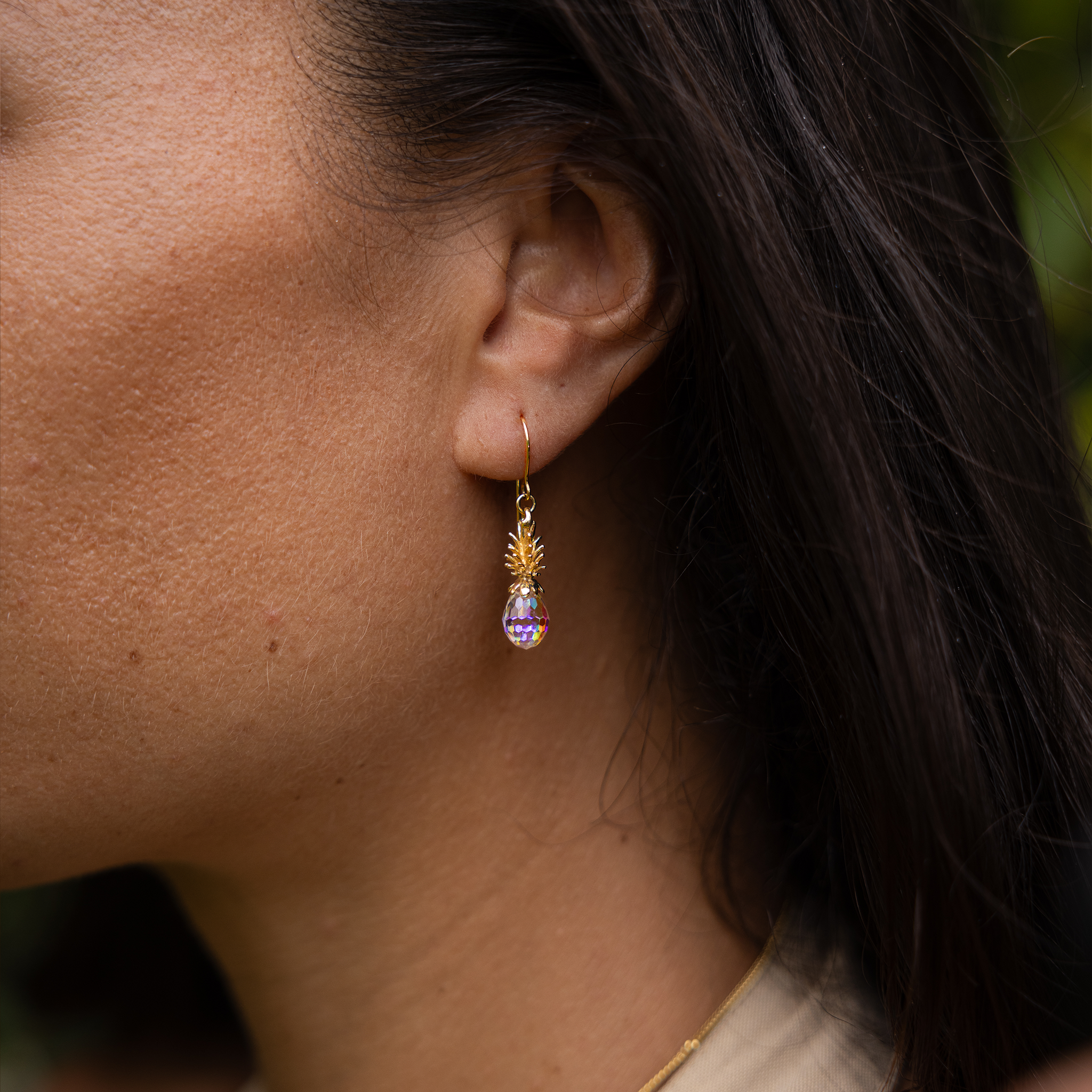 Close up of 20mm Crystal Pineapple Dangle Earrings in Gold on ear