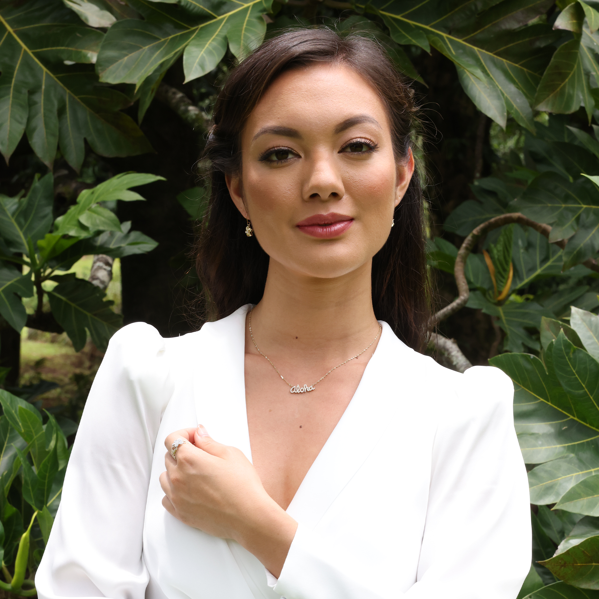 A woman wearing an Aloha Necklace in Gold with Diamonds and Plumeria Earrings - Maui Divers Jewelry