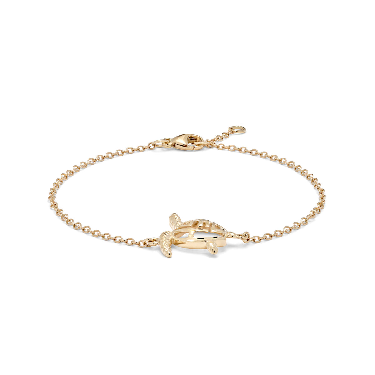 Side angle view of a 14k yellow gold link bracelet featuring a Hawaiian green sea turtle with a diamond-cut word "HONU" along its back and an adjustable link with a lobster claw clasp, shown on a white background