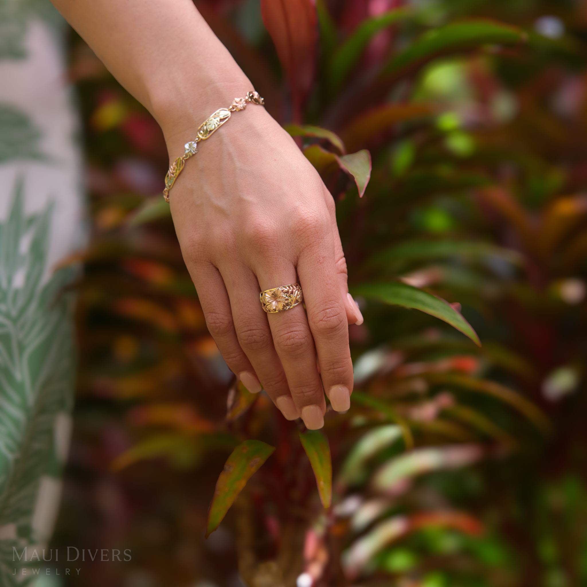 12mm Hawaiian Gardens Hibiscus Ring and Bracelet in 4 color Golds with Diamonds on hand in a garden
