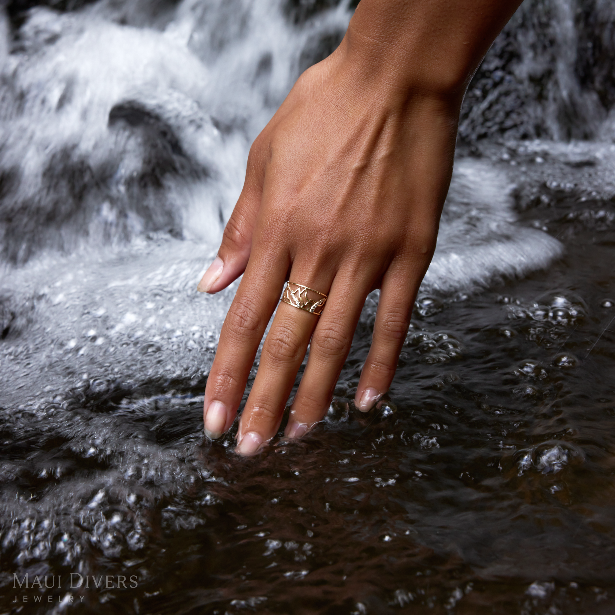 10mm Koʻolau Waterfall Ring in Gold with Diamonds on a hand in a stream