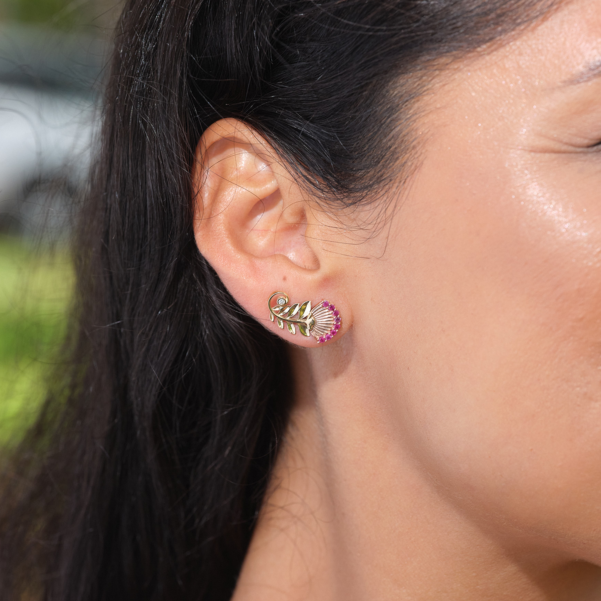 A womanʻs ear with Ohia Lehua Ruby Earrings in Two Tone Gold with Diamonds - 19mm - Maui Divers Jewelry
