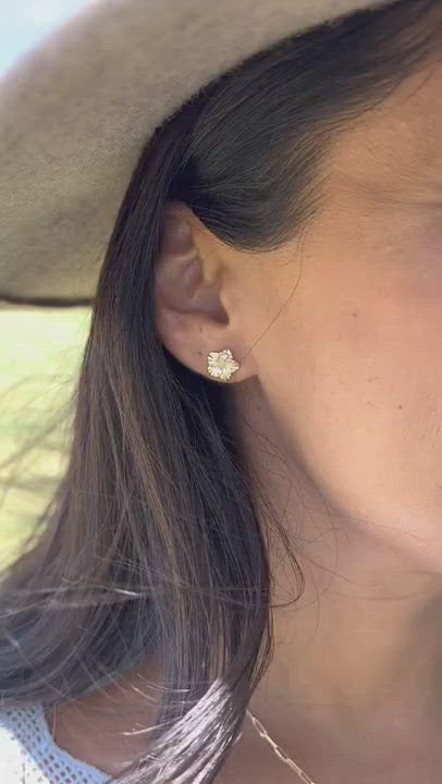 Video of a woman wearing Hawaiian Gardens Hibiscus Earrings in Gold with Diamonds - 9.5mm - Maui Divers Jewelry