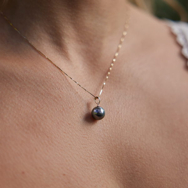 close up of Tahitian Black Pearl Pendant in Gold on neckline
