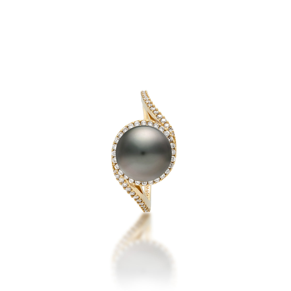 Top down view of a 14k yellow gold ring with a páve diamond band that curves to the top to form a diamond halo around a Tahitian black pearl, shown on a white background