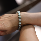 Hand with 7.5-9" Adjustable Tahitian Black Pearl Bracelet in Gold - 8-10mm by Maui Divers Jewelry
