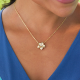 A woman wearing a Plumeria Pendant in Gold with Diamond - 16mm-Maui Divers Jewelry