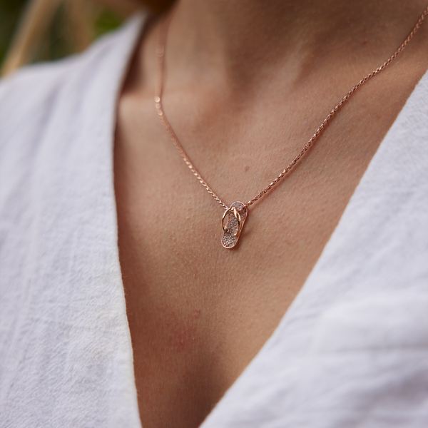 Close up of Slipper Pendant in Rose Gold with Diamonds - 18mm on woman's neckline