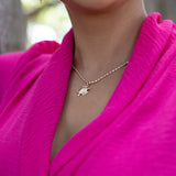 A woman wearing a 1.8mm Ovalina Chain in Gold with a pendant - Maui Divers Jewelry
