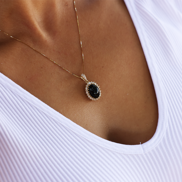 Maui Divers Jewelry Princess Ka‘iulani Black Coral Pendant in Gold with Diamonds on Chest below neckline