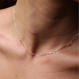 A woman wearing the 2mm Paperclip Chain in Gold - Maui Divers Jewelry