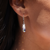 A woman wearing a Crystal Pineapple Earrings in Sterling Silver-Maui Divers Jewelry