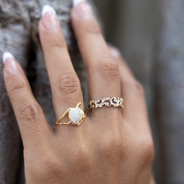A woman's hand wearing a Living Heirloom Ring in Gold with Diamonds and a ring - Maui Divers Jewelry