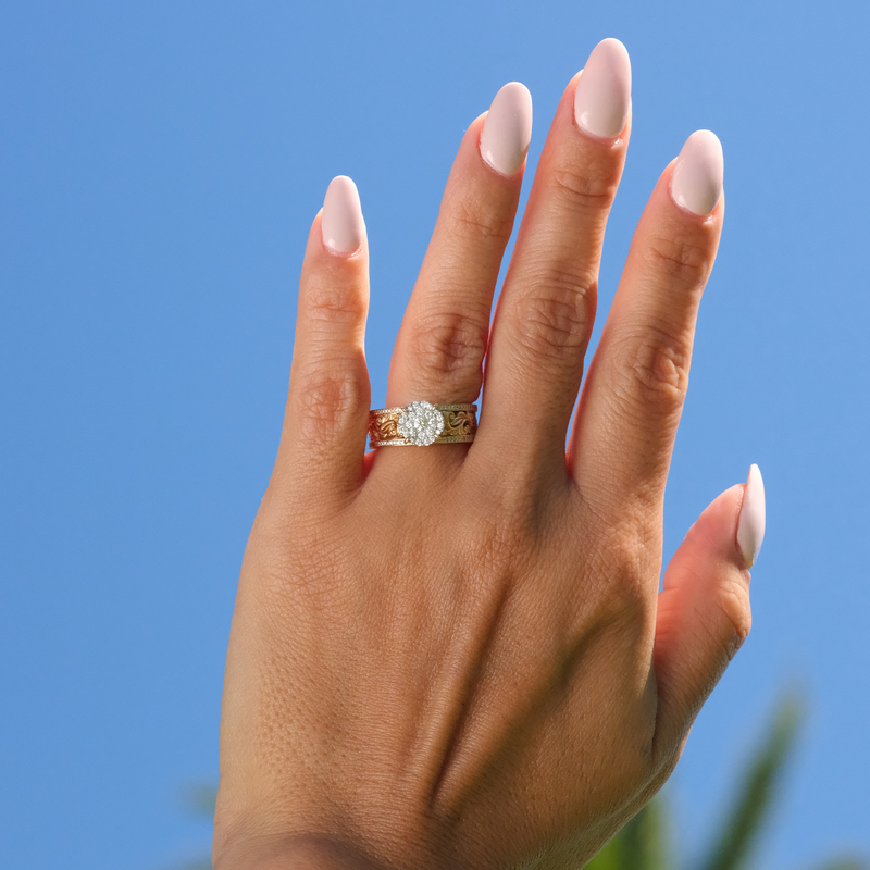 A woman's hand with a Living Heirloom Engagement Ring in Gold with Diamonds - 10mm - Maui Divers Jewelry
