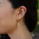 Close up of woman wearing Living Heirloom Seahorse Earrings in Gold with Diamonds - 22mm