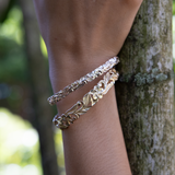 6mm and 10mm Hawaiian Heirloom Plumeria Bracelet in Gold  on wrist
