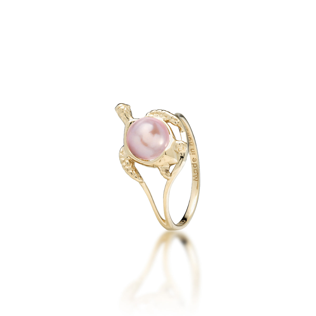 A 14k yellow gold sea turtle ring with a lavender freshwater pearl as its shell, shown on a white background