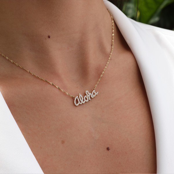 A woman's chest with an Aloha Necklace in Gold with Diamonds - Maui Divers Jewelry