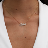 A woman's chest with an Aloha Necklace in Gold with Diamonds - Maui Divers Jewelry