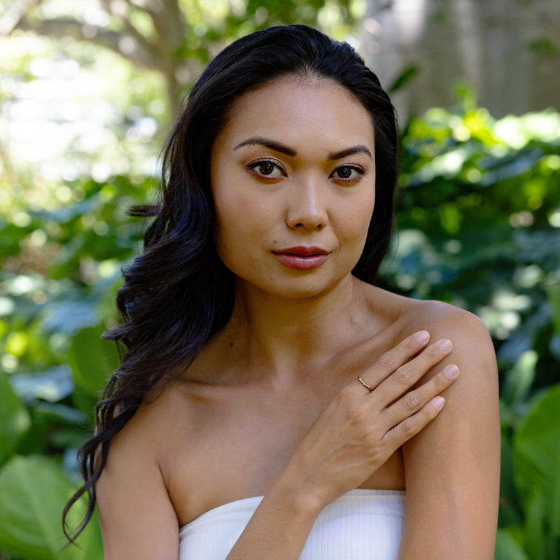 Woman wearing Heritage Ring in Gold with nature background