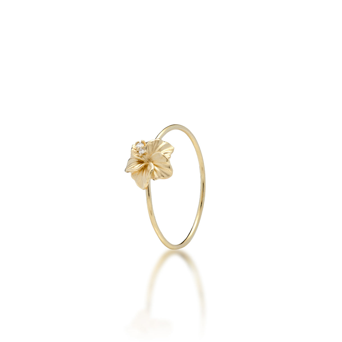 A 14k yellow gold hibiscus flower ring with satin finished petals and natural diamonds coming out from the center, shown on a white background