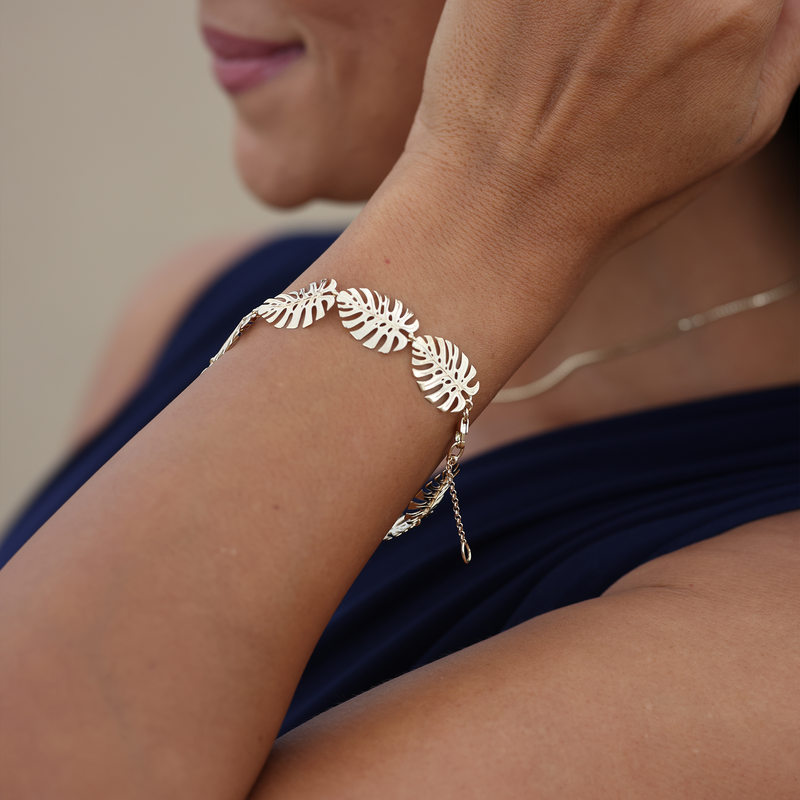 A woman wearing a Monstera Bracelet in Gold - 15mm - Maui Divers Jewelry