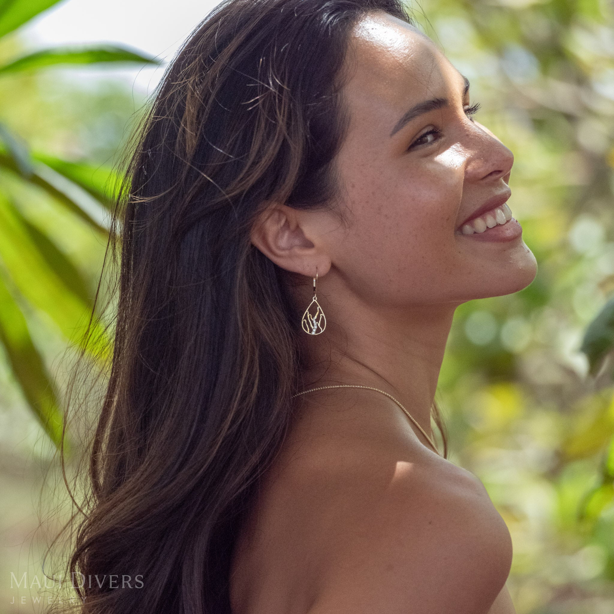 Woman smiling wearing Teardrop Koʻolau Waterfall Leverback Earrings 14k Gold with Natural Diamonds 