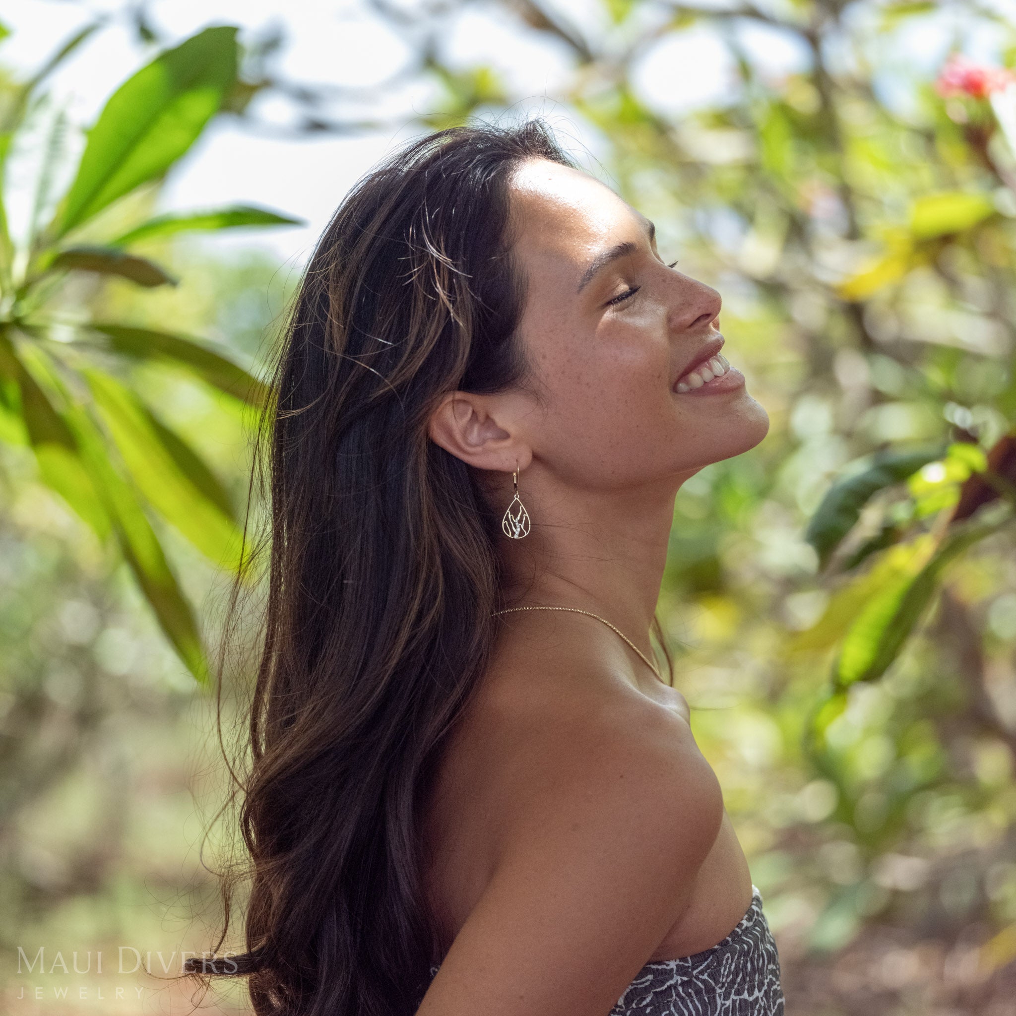 Side profile of a woman wearing Teardrop Koʻolau Waterfall Leverback Earrings 14k Gold with Natural Diamonds.